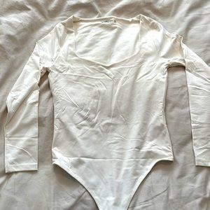 Brand new Abercrombie body suit size medium in white colour